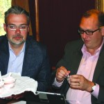 Judges Joe Morrison of the 49th State Angel Fund and Alaska Commerce Department Deputy Commissioner Jon Bittner taste Wheeler’s rhuharb sherbet as an Alaska Railroad Corp. train travels along Turnagain Arm.-Photo by Molly Dischner, Morris News Service - Alaska