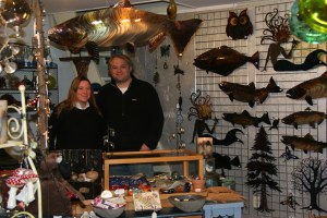 Blue Urchin owners Rebekah and Jay Pearson stand amid some of the unique items offered in their shop on the Harbor Boardwalk on the Homer Spit.-Photo by Toni Ross