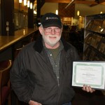 “Entrepreneur of the Year” winner, Allen Engebretsen of Bay Weld Boats, poses with his award Nov. 20 at the Homer Public Library. Engebretsen started his business in 1974.-Photo by Lindsay Olsen