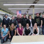 The current crew at NOMAR includes, front row from left, Sarah Swisher, Jen Hakala, Cassie Sheldon, Leza Ball, Allie Martushev; and, back row from left: Richard Mitchell, Josh Kastelle, Tiffany Ferris, Becca Richel, Bridget Kearsey, Kate Mitchell, Haz Tilter, Lance Cowan. Not shown: Gabby Damro, Tony Basargin, Kelli Somers, Margaret Quarton and Ben Mitchell.-Photo by McKibben Jackinsky, Homer News
