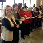 Kenaitze Tribal Council member Susan Wells leads one end of the cloth during a Dena’ina Cloth Ceremony conducted by Clare Swan at the conclusion of remarks Thursday during the grand opening celebration of the Dena’ina Wellness Center.-Photo by M. Scott Moon, Kenaitze Indian Tribe