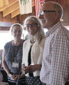 Mayor Beth Wythe, left, and other city officials paid tribute to  Port and Harbor Advisory Commission member Cathy Ulmer, with her husband, Scott, as well as other volunteers serving on the city’s board, commissions, committees and task forces.-Photo by McKibben Jackinsky, Homer News
