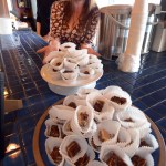 Amy Martin, owner of Vagabond Cafe and organizer of Taste of Homer, serves up another plateful of desserts at Saturday’s event.-Photo by Jim Lavrakas, Far North Photography