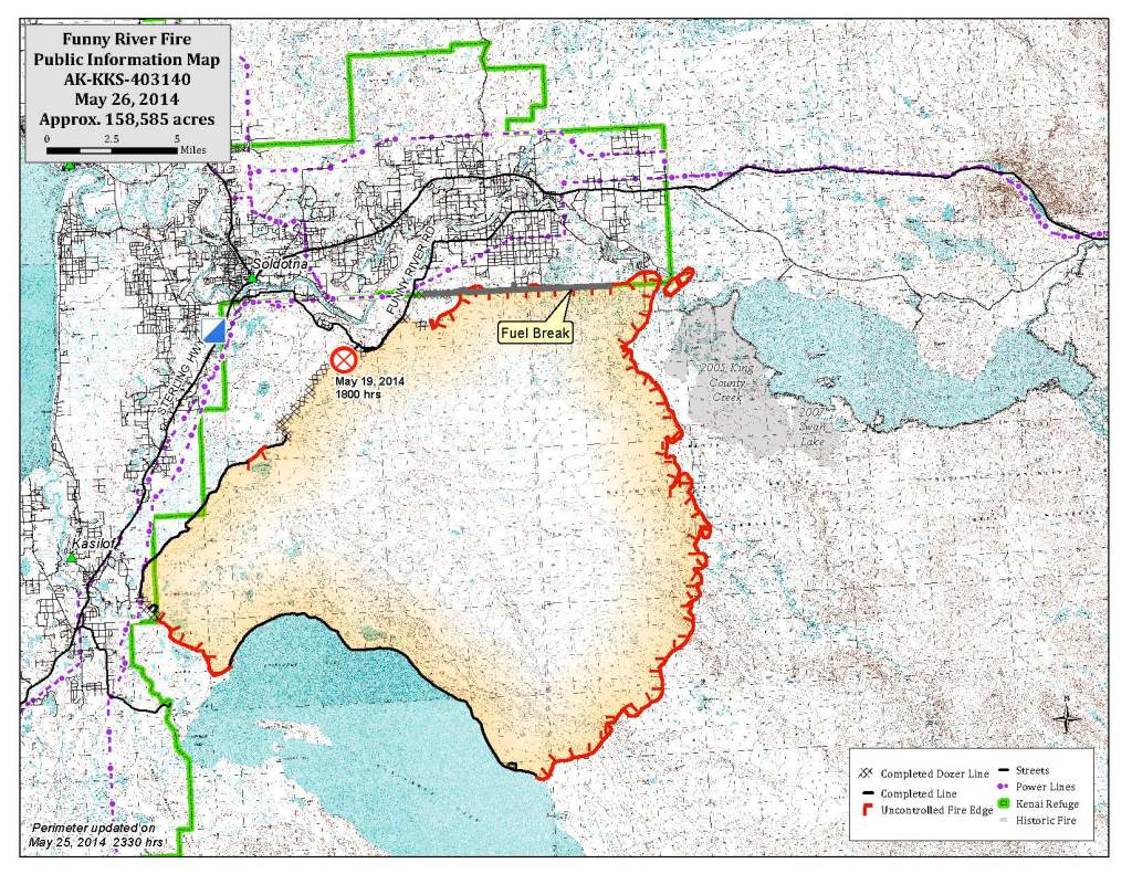 Brad Nelson, health and safety officer for Central Emergency Services, jogs back to his vehicle as he and a fire crew head to a flare up of the Funny River Horse Trail wildfire Monday May 26, 2014 in the Funny River community in Soldotna, Alaska.-Photo by Rashah McChesney/Morris News Service-Peninsula Clarion