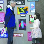 Hannah Phipps talks with her uncle, Michael McKinney, about the art displayed at the show. Paul Banks Elementary School held their First Friday Art Extravaganza on Friday, April 1 and displayed sculpture, painting, collages and other mediums of artwork in the school’s gym.