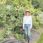 Judith James tends dozens of fruit tree spread among three orchards off East End Road.-Photo by Toni Ross