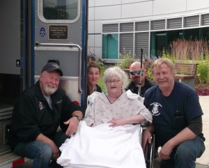 Several days before her death on Aug. 13, Connie Prouty, center, was honored for her service as an Anchor Point EMT by fellow responders (from left) Jim Dress, Cassie Parkinson, Jon Marsh and Dave Matthews.