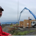 Harbormaster Bryan Hawkins checks on the progress of the new Harbormaster’s Office being built by Steiner’s North Star Construction.-Photo by McKibben Jackinsky, Homer News
