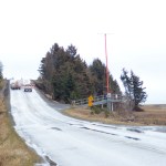 The slide on Kachemak Drive pushed a clump of spruce trees, far right, about 100 yards out into the Mud Bay slough.-Photo by Michael Armstrong, Homer News