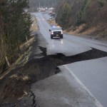Wet soils caused a section of Kachemak Drive to collapse on Sunday morning. The road is closed about a half mile from the Homer Spit Road to the top of the hill near the old airport. Kachemak Drive remains open from the East End Road intersection to the old airport.-Photo by Michael Armstrong, Homer News