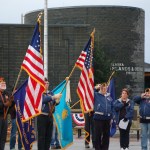 Members of the Veterans of Foreign Wars, Anchor Point Post, and American Legion Auxiliary, Post 16, salute during the playing of “Taps” at Veterans Day ceremonies at the Veterans Memorial at the Alaska Islands and Ocean Visitor Center on Tuesday.-Photo by Michael Armstrong, Homer News
