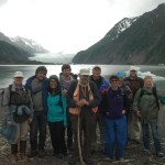 Volunteers pause in front of Grewingk Glacier Lake during the annual Trails Day on Saturday. Ed Berg, geology instructor at Kachemak Bay Campus (center wearing orange vest), led the family hike. From left are Nancy Larsen, Jeremy Sitarek, Melanie Prasad, Pryce Ragains, Berg, Don Reed, Holly Van Pelt, Michelle Waclawski, Phillip Waclawski, Diane Waclawski and Carol Sharat.-Photo by Shannon Reid