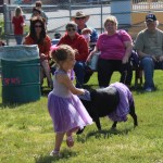 Charlotte Richardson and Milton parade in purple.-Photo by McKibben Jackinsky, Homer News