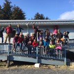 The Homer team poses with kids from the village.-Photo provided