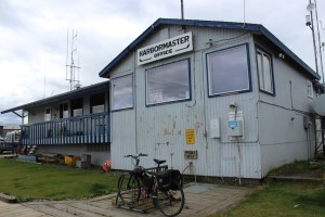Facing the Homer Small Boat Harbor, the section of the Harbormaster Office on the right is the original structure. The section on the left is remodeled restrooms.-McKibben Jackinsky, Homer News