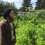 Shawn Jackinsky looks out over his garden. -Photo by Aryn Young