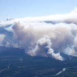 Smoke from the Funny River Horse Trail fire shoots more than 8,000 feet in the air Tuesday as the fire spread to consume nearly 7,000 acres of Kenai National Wildlife Refuge land in less than 24 hours. Dry, windy conditions have exacerbated the fire conditions spreading it into a line stretching more than 10 miles long and about 1 mile wide.-Photo by Rashah McChesney, Morris News Service - Alaska