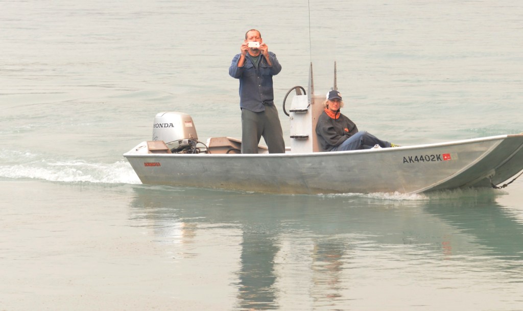 Central Emergency Services firefighters Jayson Cooper, Josh Thompson and Terry Bookey watch as aerial support arrives to dump retardent, foam and water on an extension of the Funny River Horse Trail wildfire Sunday May 25, 2014 in the Funny River community in Soldotna, Alaska. The crew, along with a few firefighters from the Kenai fire department, responded to the advancing fire at 34754 Killey Street along the banks of the Kenai River — the area had been evacuated half an hour before they arrived.-Photo by Rashah McChesney/Morris News Service-Peninsula Clarion
