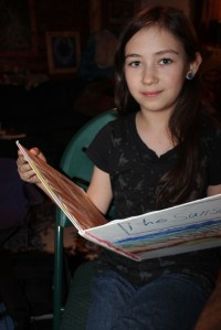 Connections student Zion Jackinsky reads from “The Sunset,” an unpublished book she wrote and illustrated.