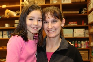 Brooke Shafer, left, and her mother, Tanya, celebrate the 18 inches of hair Brooke donated to Wigs for Kids, an organization providing hair replacement systems for children that have lost their hair due to illness or medical treatments.-Photo by McKibben Jackinsky, Homer News