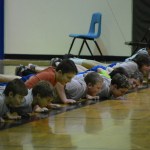 Homer Middle School boys try out the seal hop during Native Youth Olympics demonstrations on Thursday.-Photos by Michael Armstrong