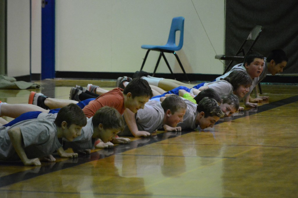 Homer Middle School boys try out the seal hop during Native Youth Olympics demonstrations on Thursday.-Photos by Michael Armstrong