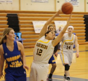 Mariner Sofia Clark reaches for a pass against Monroe as teammate Madison Akers looks on.-Photo by Lindsay Olsen