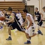 Mariner John Walsworth, 33, takes the ball and the action to the Homer side of the court in a game against Cordova on Jan. 11.-Photo by McKibben Jackinsky, Homer News