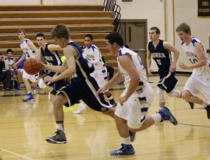 Mariner John Walsworth, 33, takes the ball and the action to the Homer side of the court in a game against Cordova on Jan. 11.-Photo by McKibben Jackinsky, Homer News