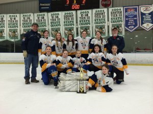 The Kenai Ice Hawks, a team a team made up of players from Homer and the Kenai area who are used to facing each other as rivals, joined forces last weekend and brought home the second place trophy from the Alaska Girls Hockey Championship in Anchorage. Posing with the trophy are, back row from left, Coach Scott Shelden, Claire Bryant, Corsica Skibinski, Rian Runyan, Rachel Bolin, Tammy Frates, and Coach Ward Bishop; in middle, from left, are Haylee Owen, Libby Miller, Katerina KuZmin, Delilah Harris and Fiona Hatton; and in front is Jordan Stock.