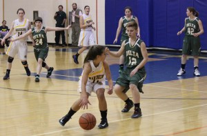 Mariner Maggie Koplin, No. 11, controls the ball during the game with Delta Junction while teammates Madison Akers, No. 14, and Tayla Cabana, No. 32, watch her back.-Photo by McKibben Jackinsky, Homer News