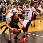Seldovia’s Seth O’Leary grabs a rebound and looks for an opening to pass during the March 7 game against Nikolaevsk at Skyview High School. -Photos by Rashah McChesney, Peninsula Clarion