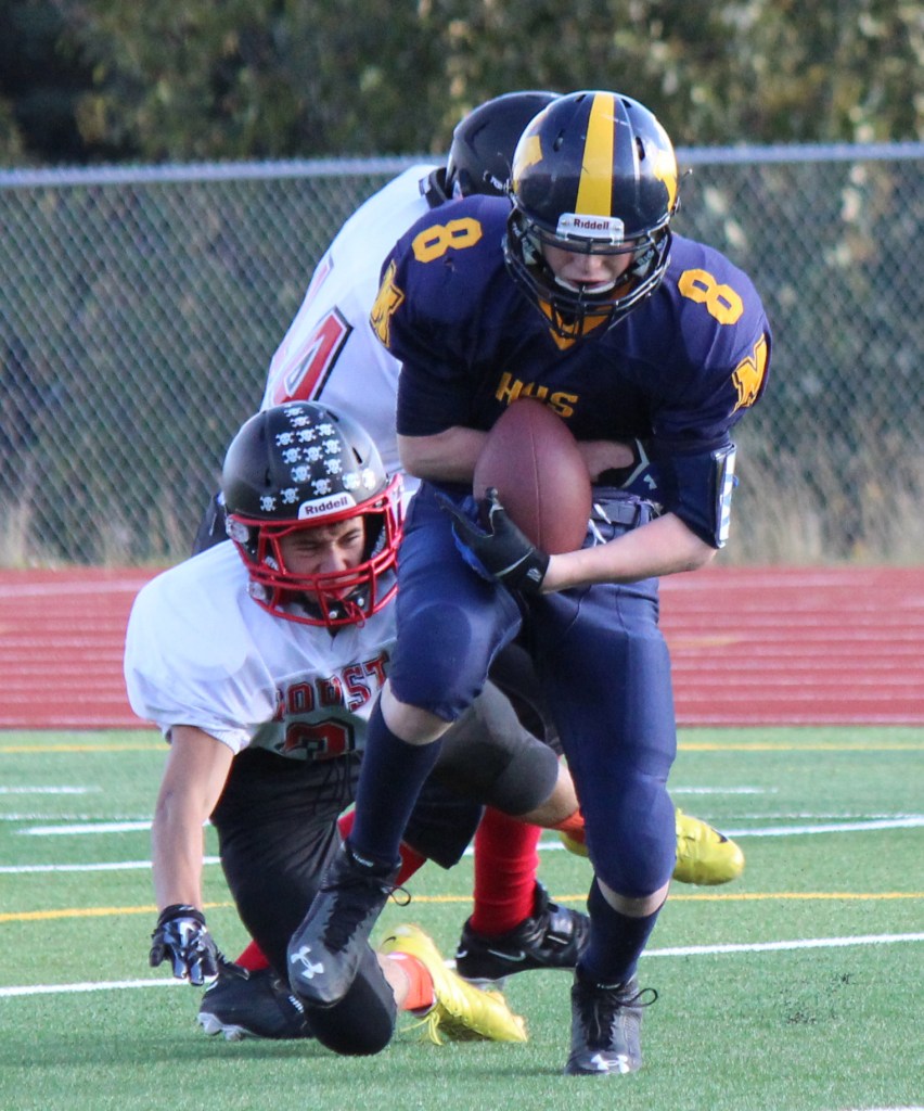 Teddy Croft, 8, scores a touchdown for the Homer Mariners in Saturday’s game against the Houston Hawks.-Photo by McKibben Jackinsky, Homer News