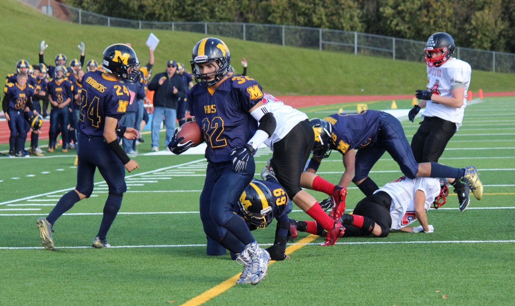 Josh Fisk, 32, gives the Mariners a two-point conversion in the first quarter of Saturday’s game against the Houston Hawks.-Photo by McKibben Jackinsky, Homer News