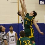 Sheldon Hutt reaches for the tip-off in the Mariner boys’ game against Seward.-Photo by Lindsay Olsen