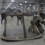 Mariner goalie Markina Polushkin, a senior, directs the puck away from the net during Tuesday’s game against the SoHi Stars.-Photo by McKibben Jackinsky, Homer News