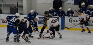 Mariners Robby Larson, 23, and Dimitry Kuzmin, 12, face off with the Palmer Moose during Friday’s game at the Kevin Bell Arena. -Photo by Tracey Tillion