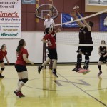 Seldovia Otters Olivia Turner, 1, Violet Mitchell, 21, and Chance Haller, 12, take the battle to the net in play against Nikolaevsk Warriors Greg Trail, Jonah Fefelov and Kilina Klaich, 2.-Photo by McKibben Jackinsky, Homer News