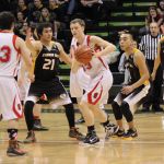 Seldovia's Dylan Waterbury, 23, and Aidan Philpot, 33, keep the ball away from Scammon Bay during State championship play in Anchorage, March 18.-Photo by McKibben Jackinsky, Homer News