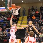 The Otters' Calem Collier, 24, notches up Seldovia's score in the game against Scammon Bay in a battle to be the top iA basketball team in the state.-Photo by McKibben Jackinsky, Homer News