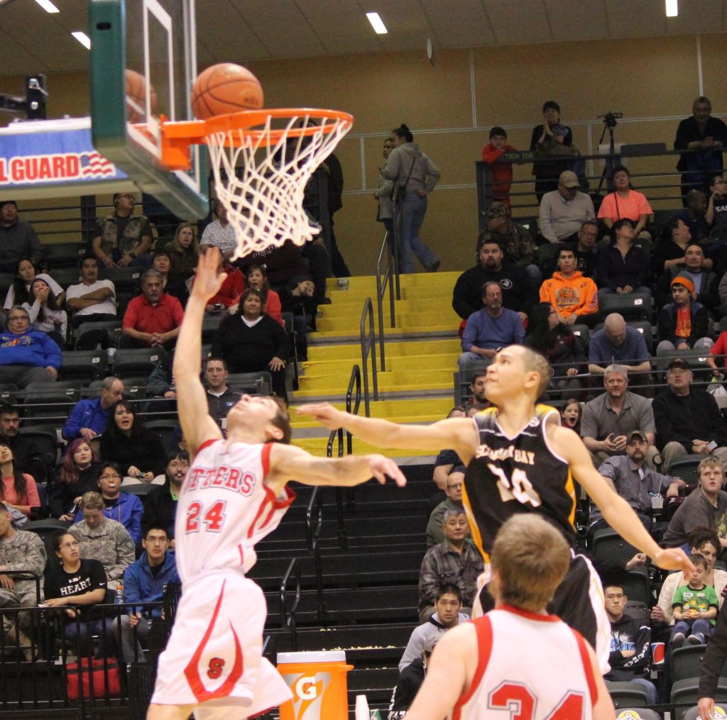 The Otters' Calem Collier, 24, notches up Seldovia's score in the game against Scammon Bay in a battle to be the top iA basketball team in the state.-Photo by McKibben Jackinsky, Homer News