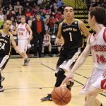 Seldovia's Calem Collier, 24, outmaneuvers Scammon Bay's Angel Medina in the battle for the 1A State championship.-Photo by McKibben Jackinsky, Homer News