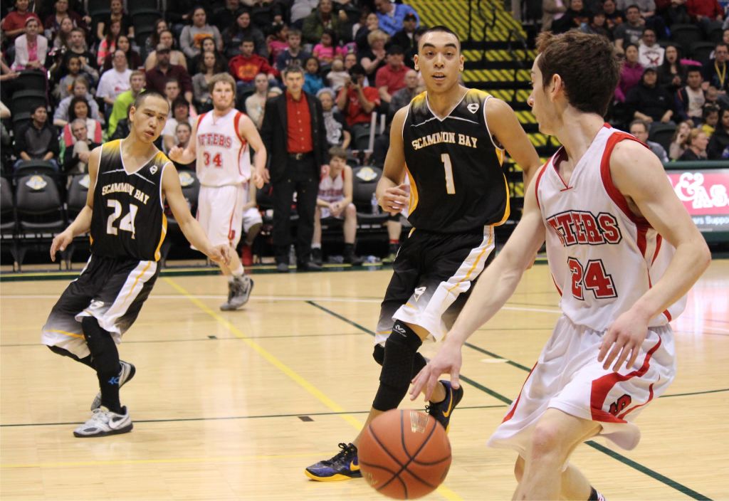 Seldovia's Calem Collier, 24, outmaneuvers Scammon Bay's Angel Medina in the battle for the 1A State championship.-Photo by McKibben Jackinsky, Homer News