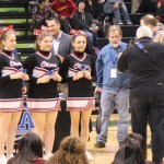 The Seldovia Sea Otter cheerleaders are recognized for their energetic support of their during the award ceremony at the ASAA 1A State Basketball Tournament. From left: Lisa Neumann, Violet Mitchell, Ariana Waterbury. -Photo by McKibben Jackinsky, Homer News