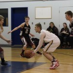 Ninlichik’s Tyler Presley brings it right back a few seconds later in last Thursday’s fast-paced game. -Photo by McKibben Jackinsky, Homer News