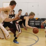 Nikolaevsk’s Neil Gordeev, takes the ball one direction.-Photo by McKibben Jackinsky, Homer News