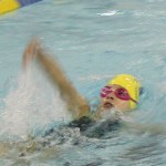KSC swimmer Carly Nelson, 9, competes Saturday morning. -Photo by McKibben Jackinsky, Homer News