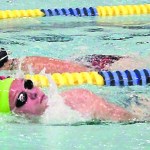 Jenna Fabich, front, and Lauren Kuhns, back, swim 1,000 yards at Kate Kuhns Aquatic Center during the first leg of the triathlon.