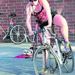 Lila Johnson begins the bicycle leg of the triathlon.