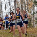 Mariners Molly Mitchell, 452, Megan Pitzman, 451, and Alex Mosley, 453, run in the girls varsity 123A state cross-country championship in Anchorage on Saturday. The Homer girls team earned a state championship title and the boys scored a third-place finish.-Photo by Jim Wolfe
